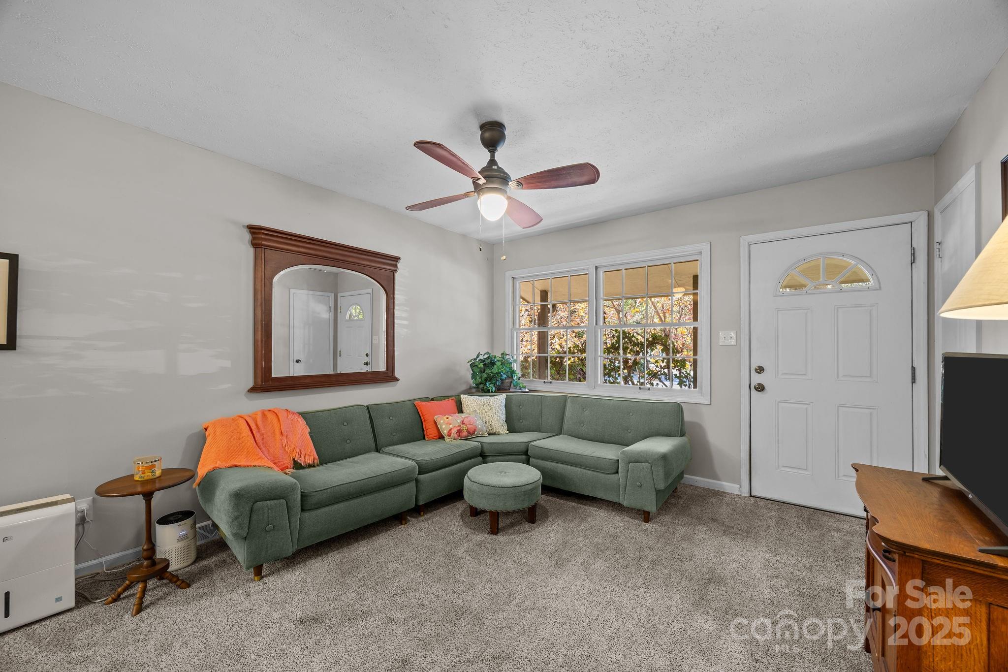 3228 Sweeten Creek Road Asheville, NC 28803 - Photo 26 of 48 a living room with furniture and a flat screen tv