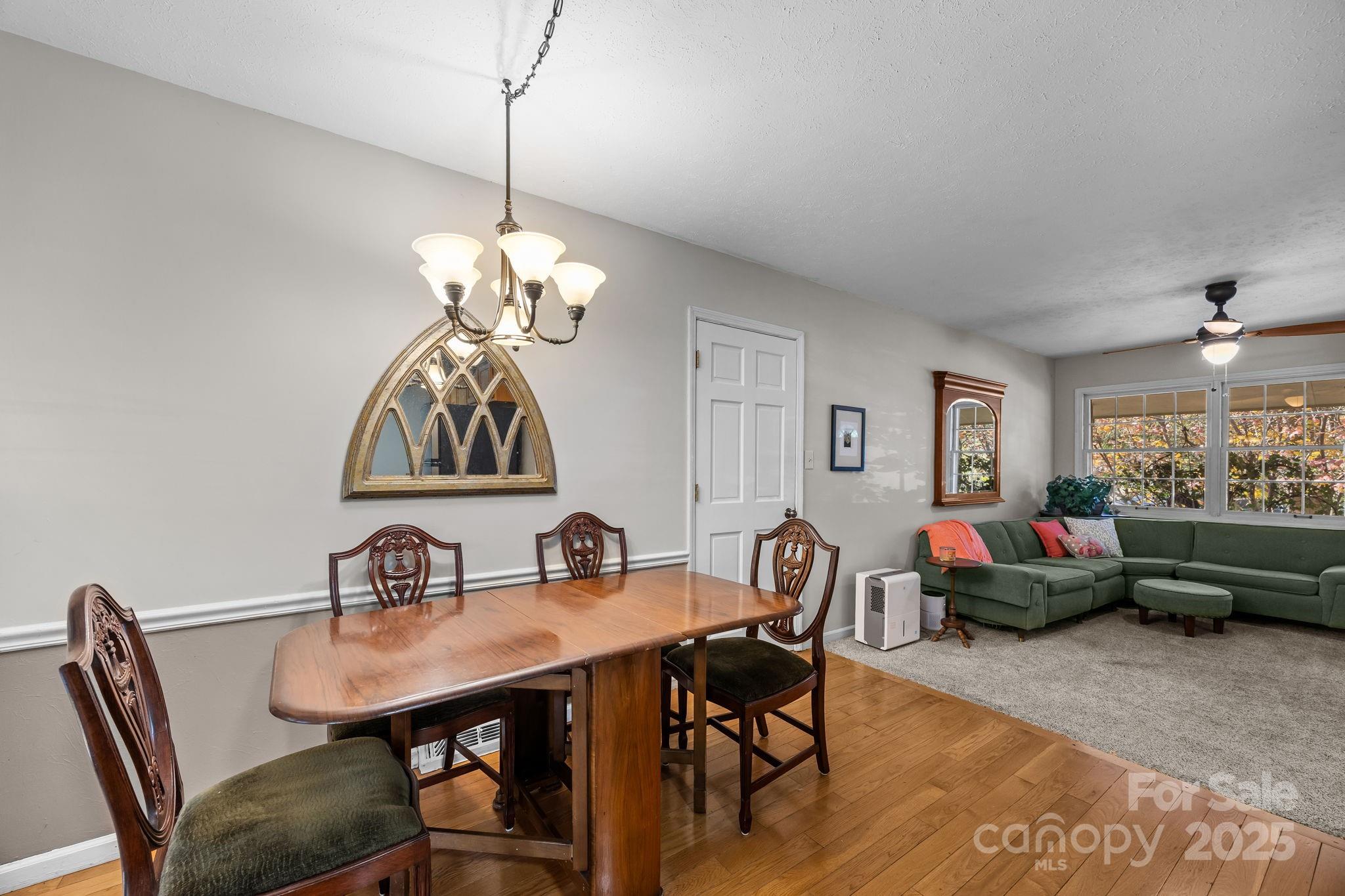 3228 Sweeten Creek Road Asheville, NC 28803 - Photo 29 of 48 a view of a dining room with furniture window and outside view