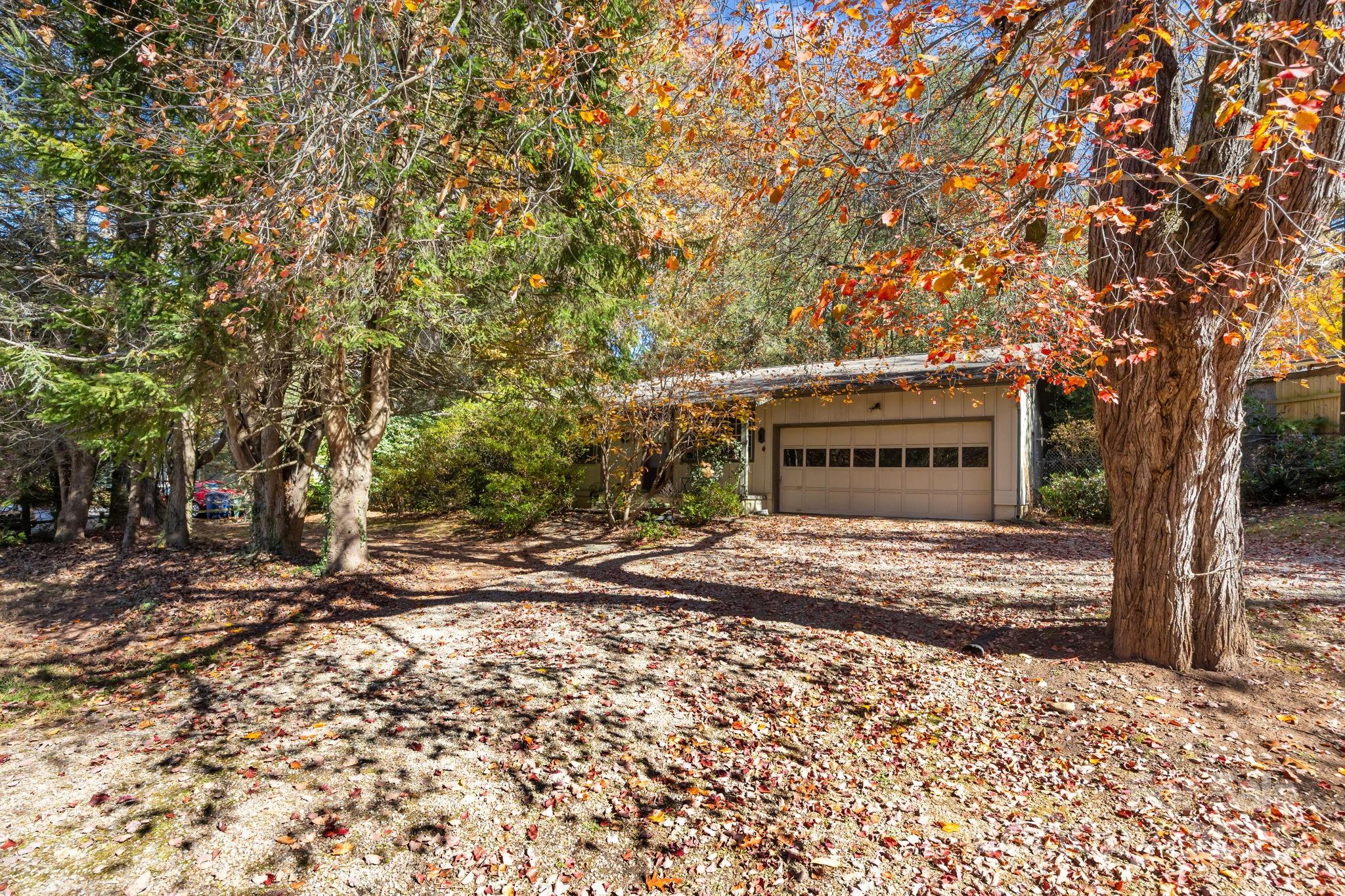 3228 Sweeten Creek Road Asheville, NC 28803 - Photo 4 of 48 a pathway of a house with a yard