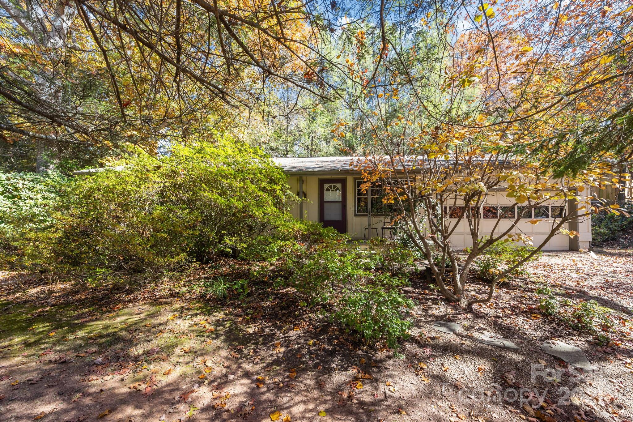 3228 Sweeten Creek Road Asheville, NC 28803 - Photo 7 of 48 a view of a house with a tree