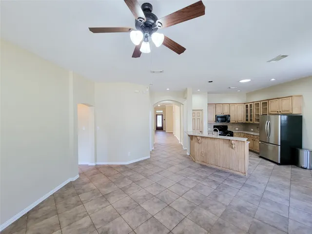 a white bath tub sitting in a bathroom next to a window