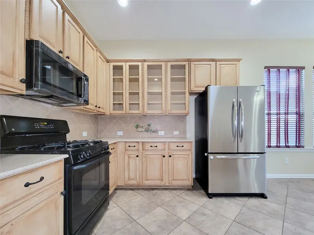 a view of a backyard with plants and a garden