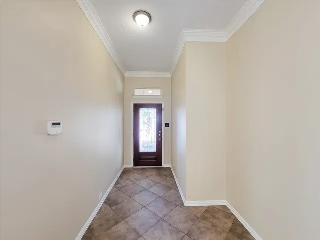 a large kitchen with stainless steel appliances granite countertop a refrigerator and a sink