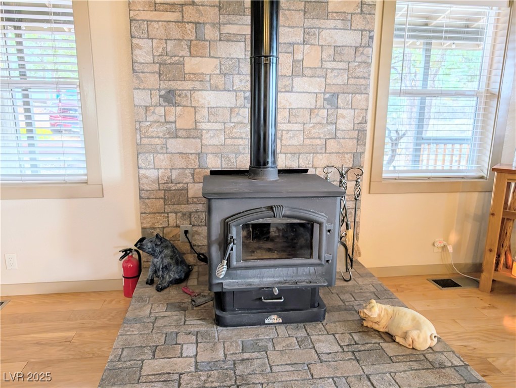 8320 Mother Lode Road Pioche, NV 89043 - Photo 26 of 46 Detailed view of a wood stove and wood finished floors