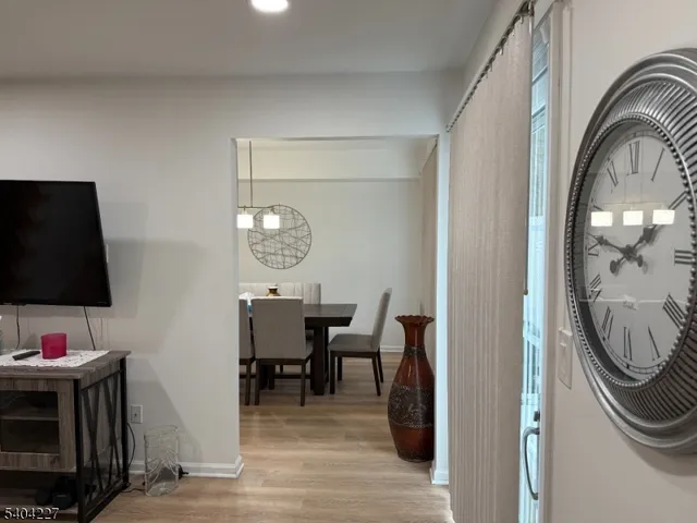 a view of a livingroom with furniture and wooden floor
