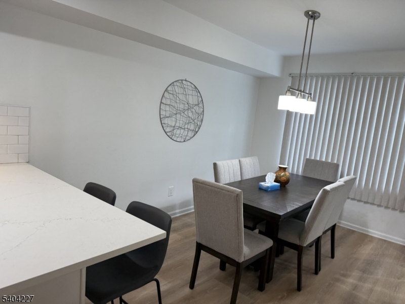 6 Paula Way Berkeley Heights, NJ 07922 - Photo 7 of 14 a view of a dining room with a table and chairs