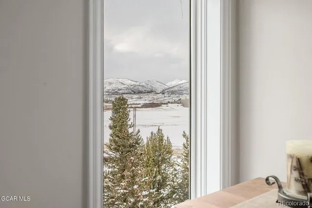 a view of a glass door and a window