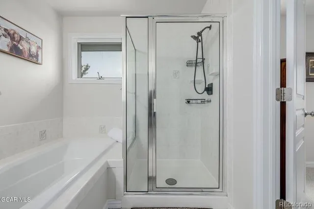 a bathroom with a glass shower door