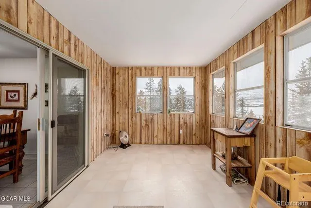 a view of balcony with furniture and trees
