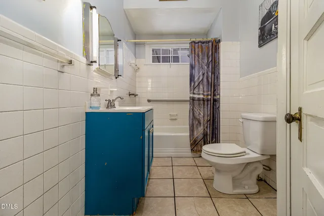 a bathroom with a toilet and a sink