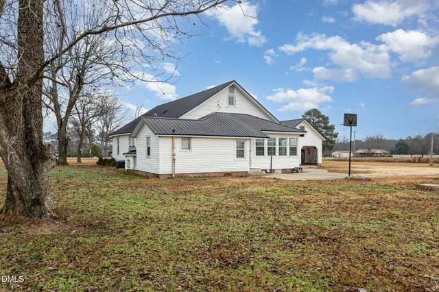 a house with trees in front of it