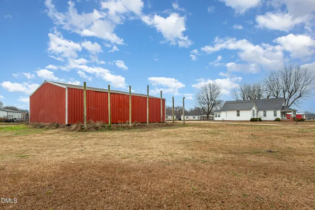 a view of a field with a big yard