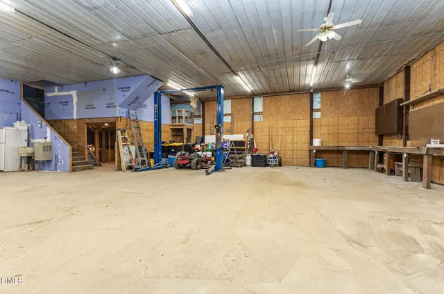 a big room with lots of furniture and a chandelier