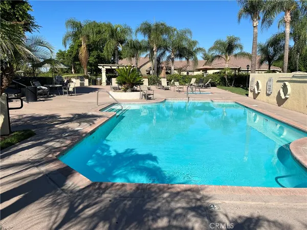 a view of a swimming pool with a patio
