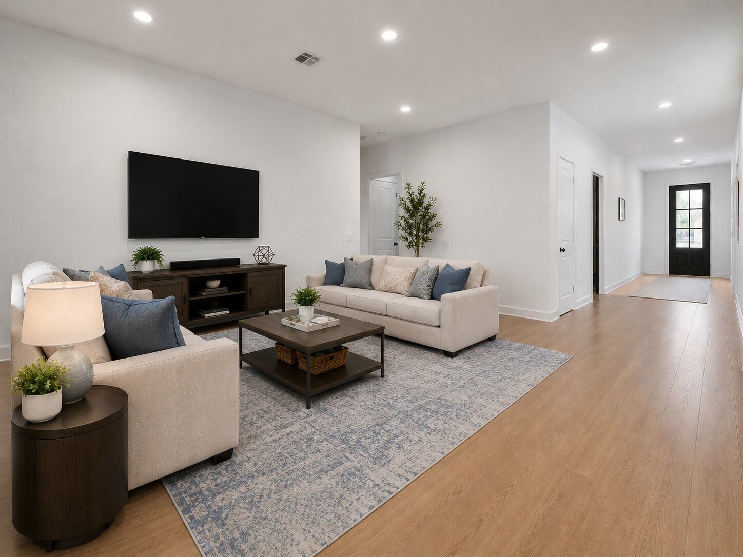 2720 Grove Crest Drive Rosenberg, TX 77469 - Photo 16 of 32 Expansive family room offering flexible living space, recessed lighting, and a seamless flow to the home's open-concept layout.