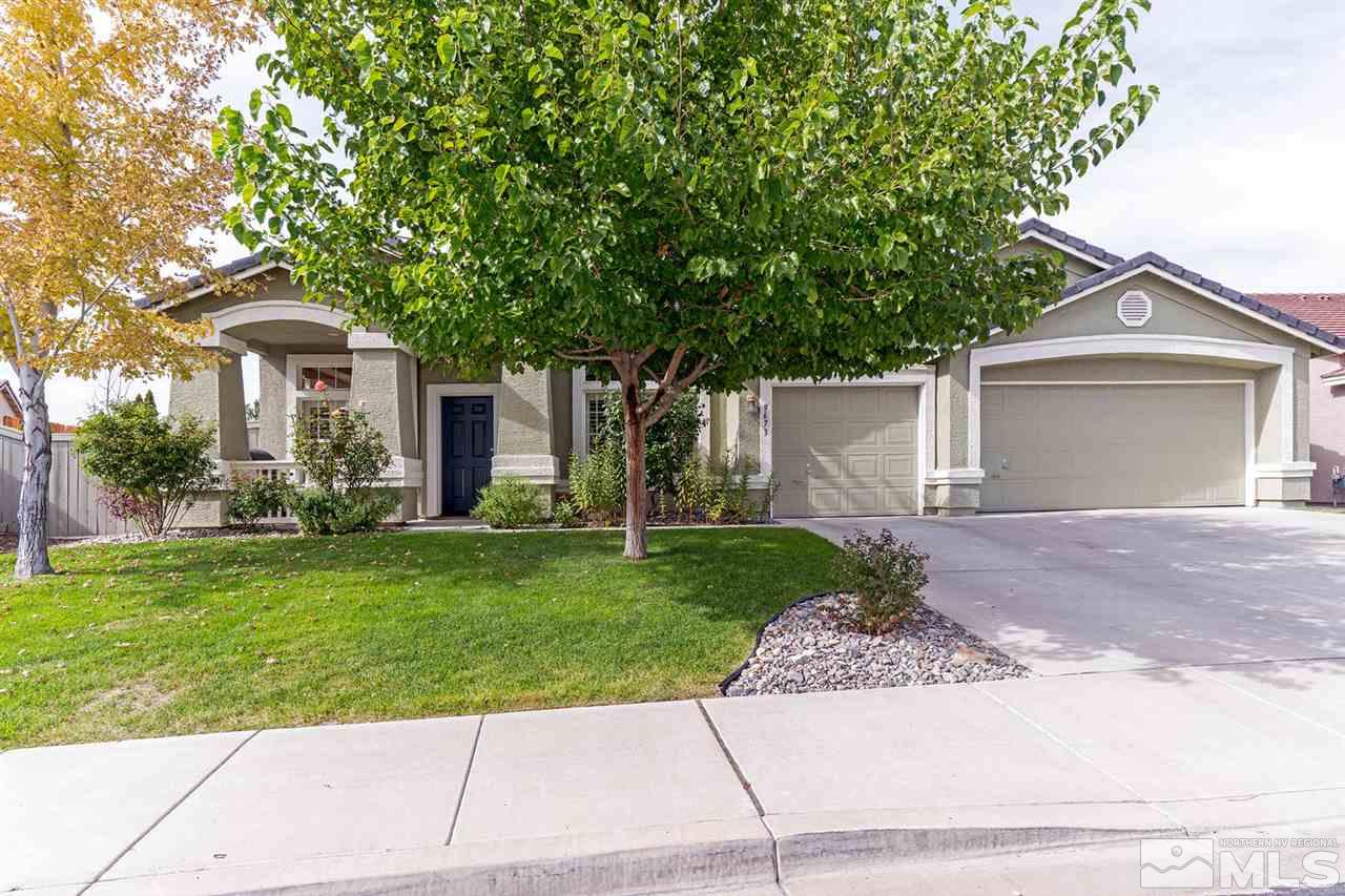 9673 Glen Ridge Drive Reno, NV 89521 - Photo 1 of 1 a front view of a house with a garden