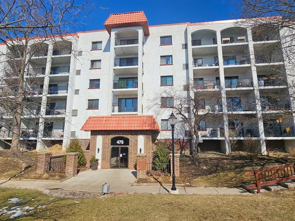 a front view of a building with glass windows