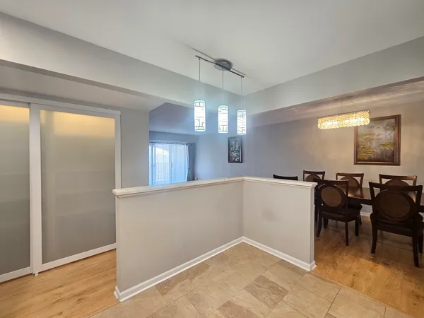a view of a hallway with seating area