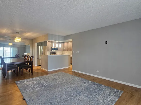 a view of a kitchen and dining room