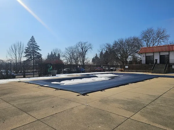 a front view of a house with basket ball court