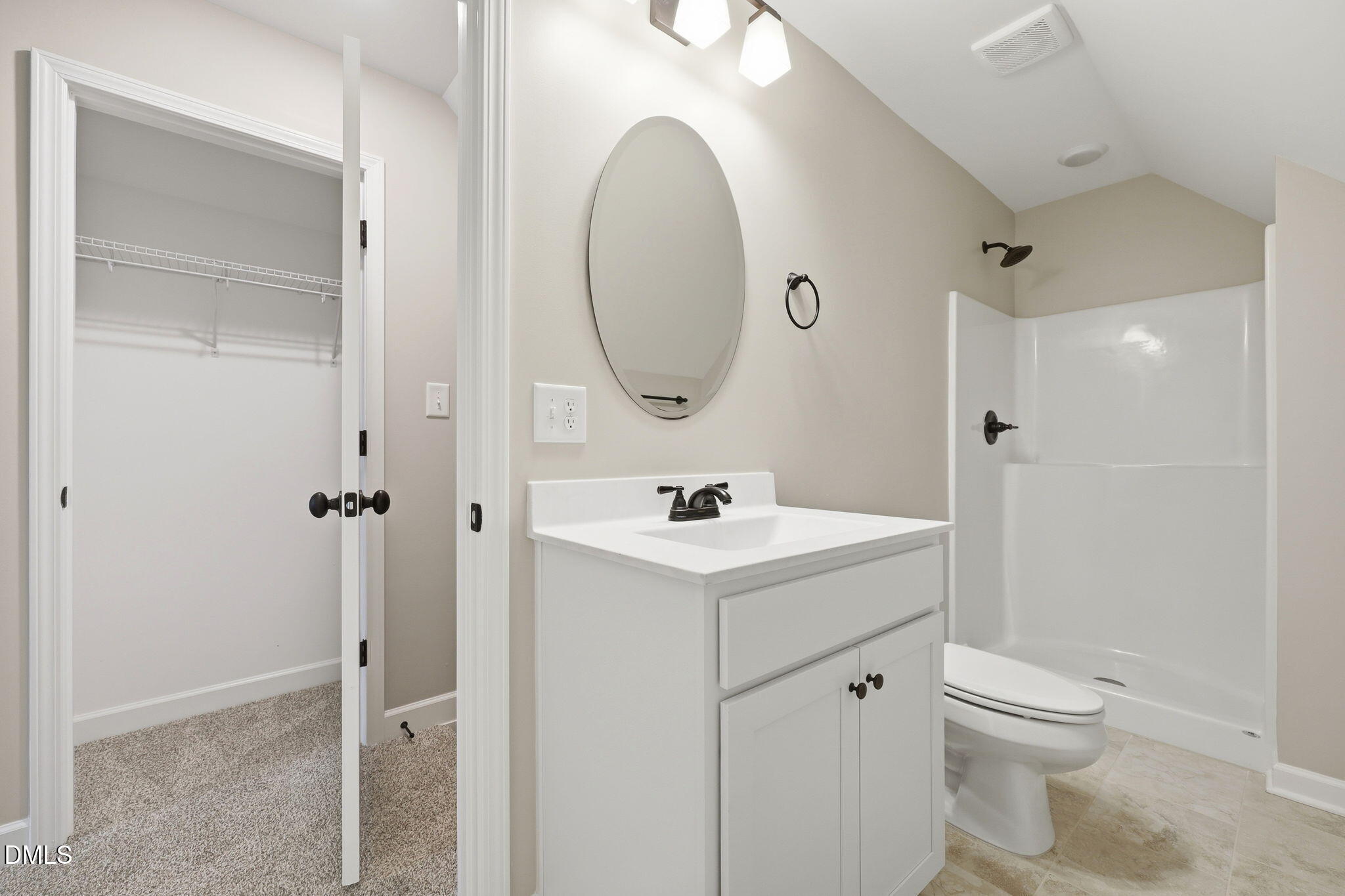 146 Seahawk Way Zebulon, NC 27597 - Photo 36 of 51 a bathroom with a sink a toilet and a mirror