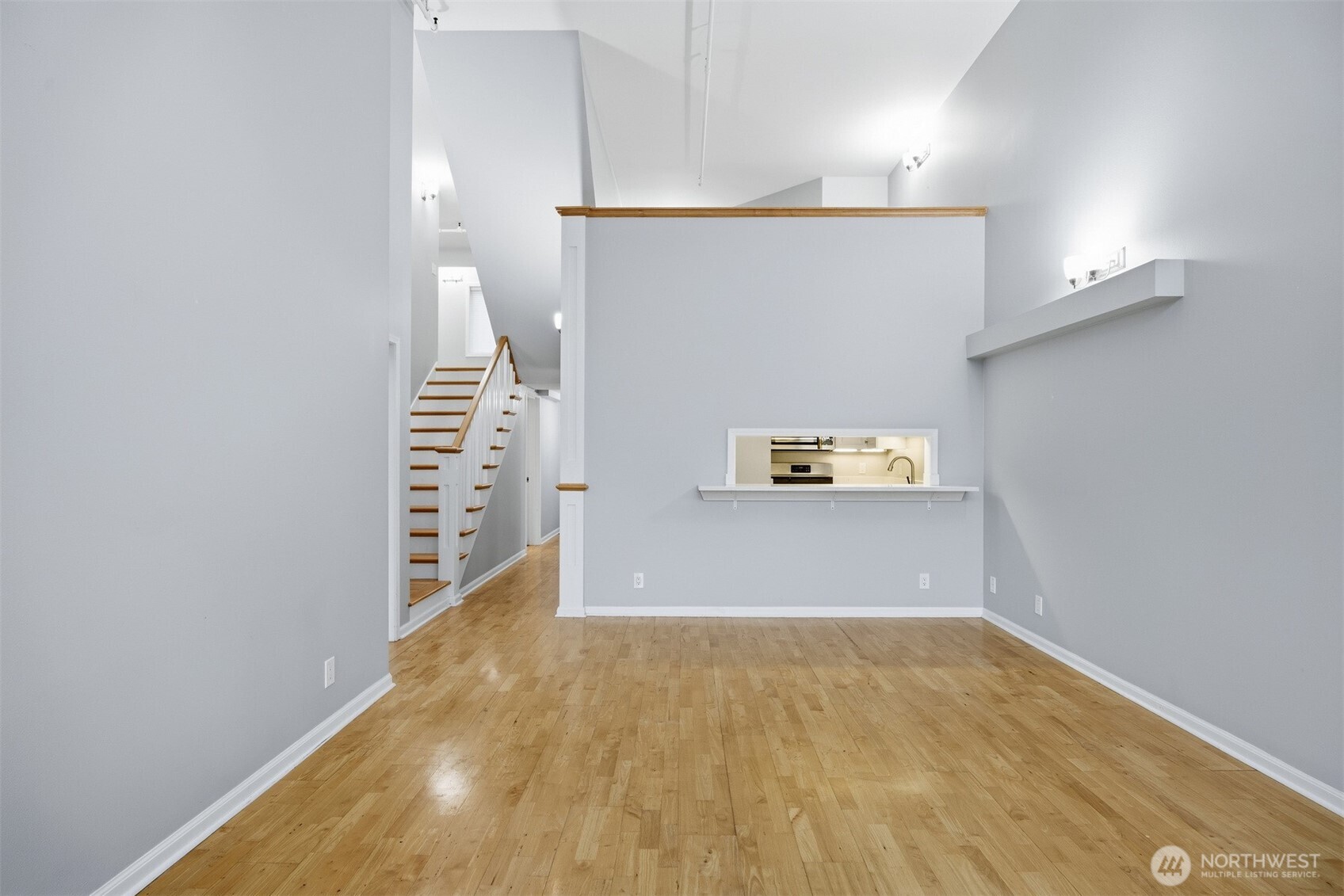 1201 11th Street, Unit 303 Bellingham, WA 98225 - Photo 9 of 34 a view of a hallway with wooden floor and stairs