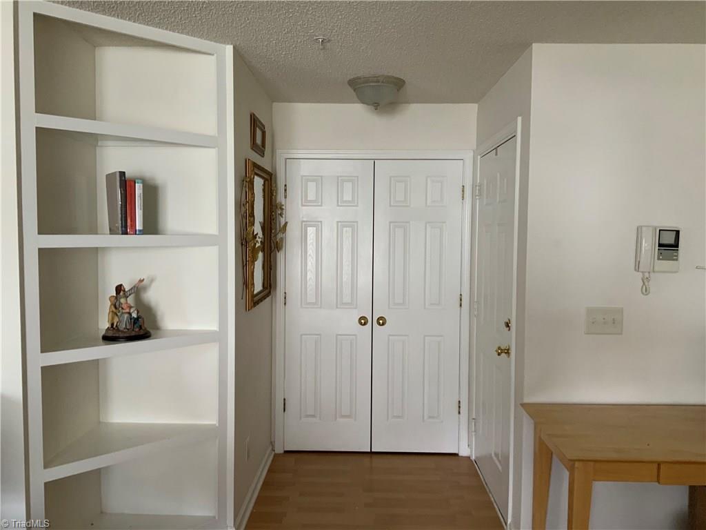 133 James Road, Unit 2C High Point, NC 27265 - Photo 3 of 14 Front entrance with coat closet and built in shelves