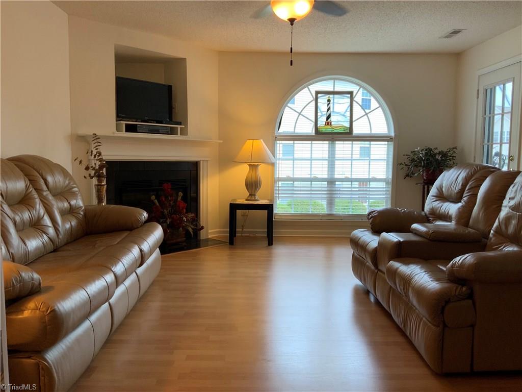 133 James Road, Unit 2C High Point, NC 27265 - Photo 4 of 14 Large, open living room with gas fireplace