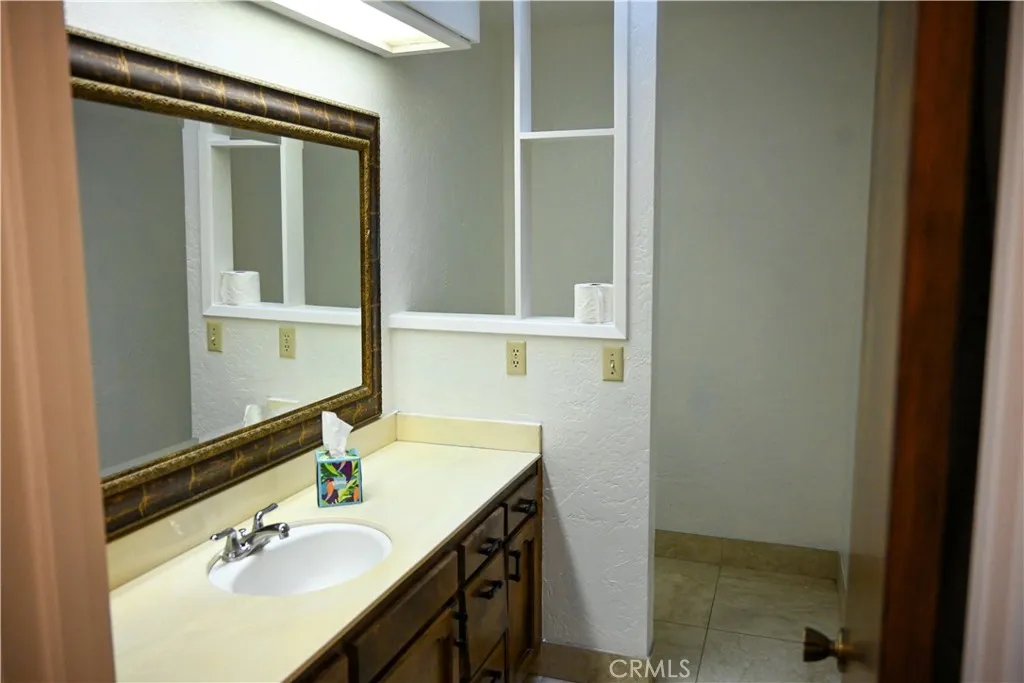 309 15th Street Paso Robles, CA 93446 - Photo 10 of 23 a bathroom with a sink and a mirror