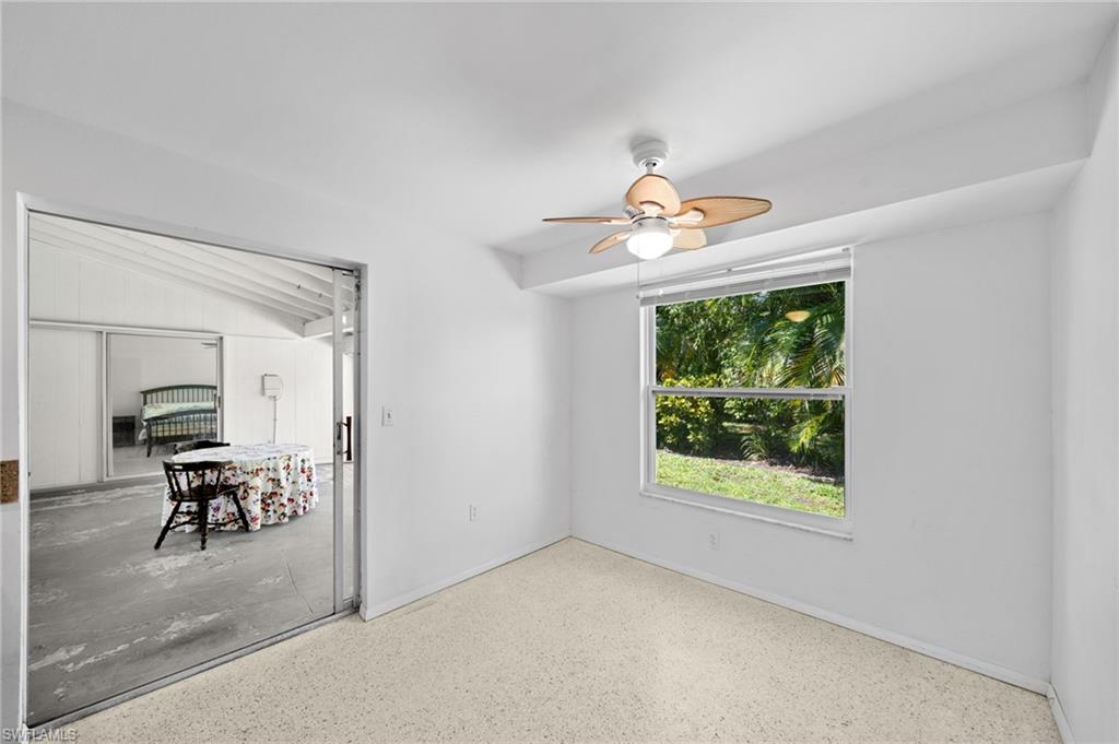 6 Maui Circle Naples, FL 34112 - Photo 11 of 22 an empty room that has a window