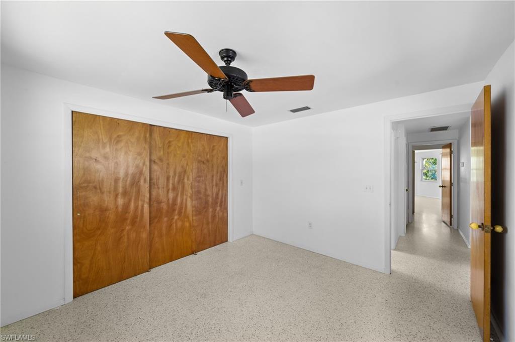 6 Maui Circle Naples, FL 34112 - Photo 16 of 22 wooden floor in an empty room