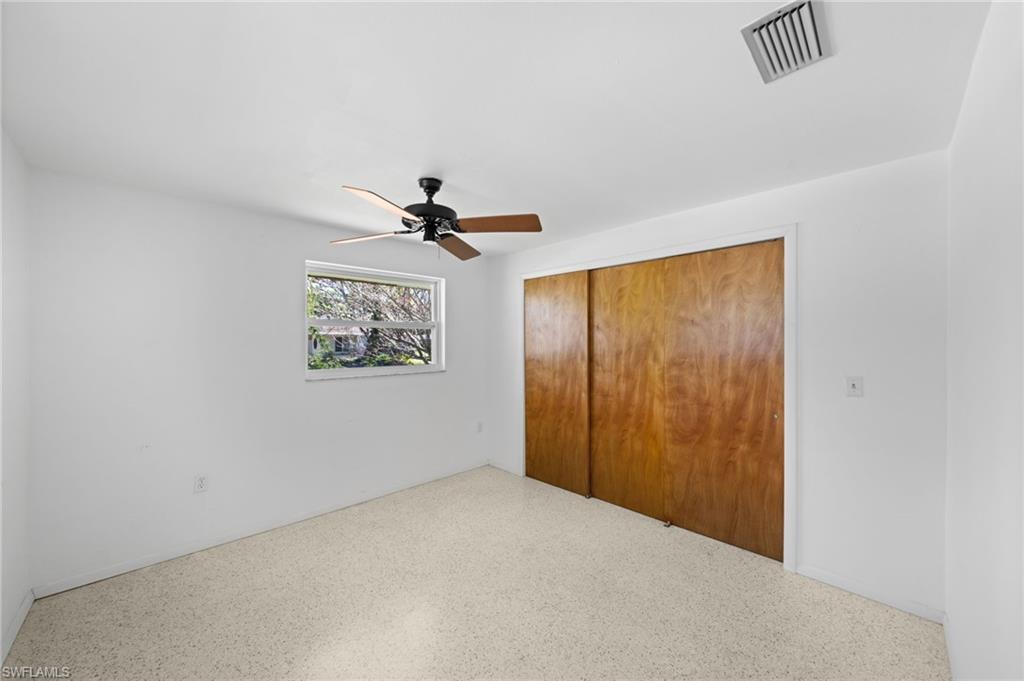 6 Maui Circle Naples, FL 34112 - Photo 17 of 22 a view of a hallway with a large window