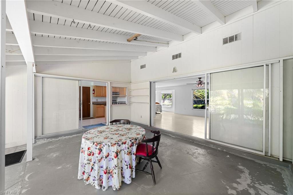 6 Maui Circle Naples, FL 34112 - Photo 19 of 22 a bedroom with furniture and window