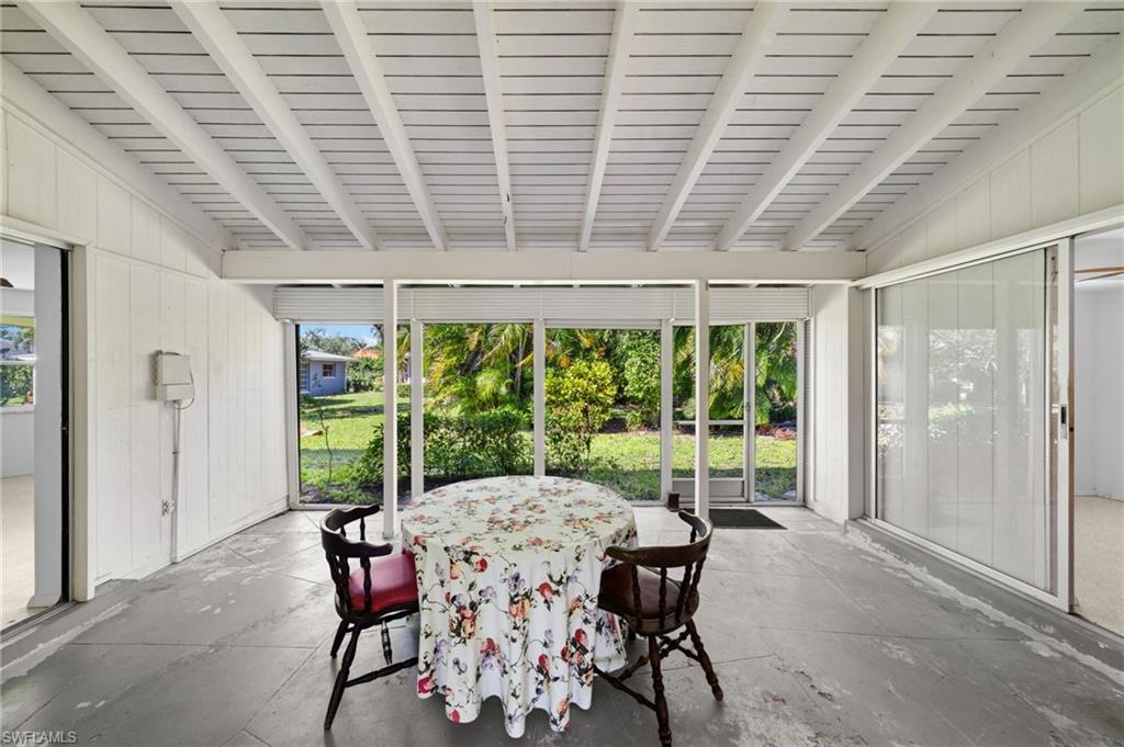 6 Maui Circle Naples, FL 34112 - Photo 20 of 22 a dining room with furniture and window