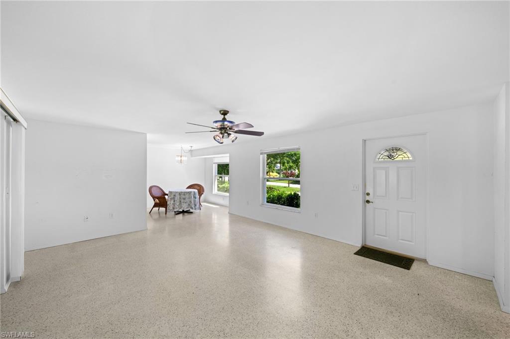6 Maui Circle Naples, FL 34112 - Photo 5 of 22 a view of an empty room with a window