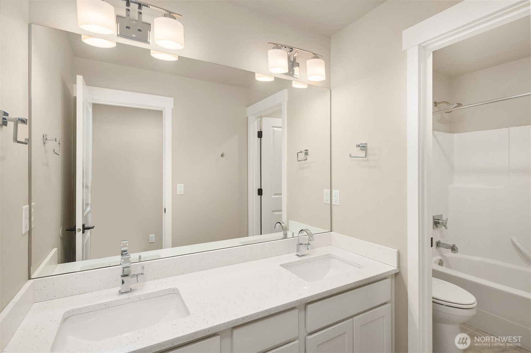 1435 242nd Place Southeast Bothell, WA 98021 - Photo 34 of 40 a bathroom with a sink a toilet and a mirror