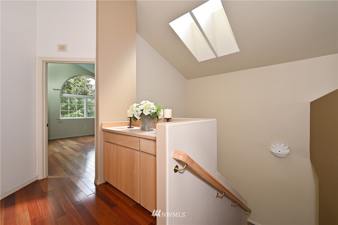6223 Cady Road, Unit A Everett, WA 98203 - Photo 14 of 30 a view of a hallway with wooden floor