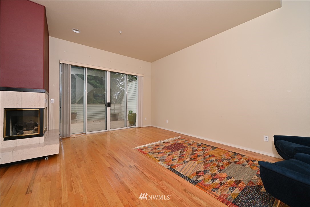 6223 Cady Road, Unit A Everett, WA 98203 - Photo 4 of 30 a bedroom with a bed and a fireplace