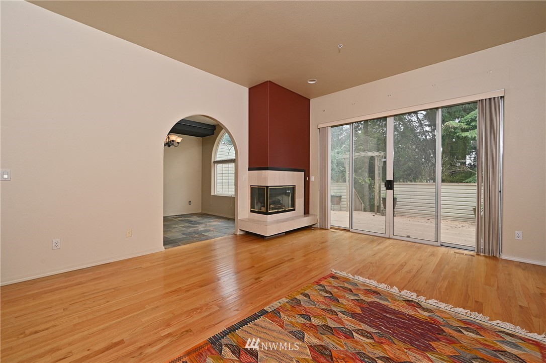 6223 Cady Road, Unit A Everett, WA 98203 - Photo 5 of 30 a view of a room with wooden floor and a fireplace