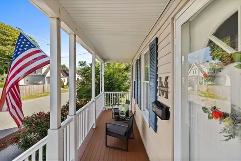 a view of roof deck with furniture and garden