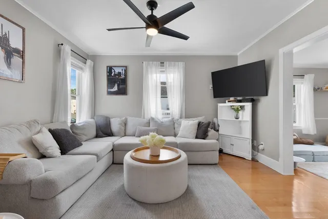 a living room with furniture and a flat screen tv