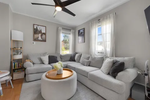 a living room with furniture and a window
