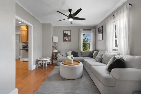 a living room with furniture and a window