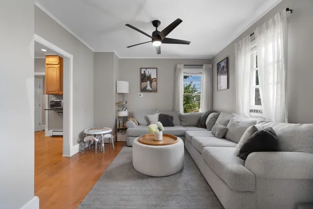 a living room with furniture and a window