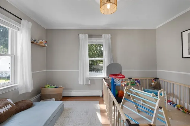 a living room with furniture chess table and a window