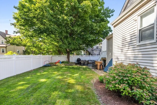 a view of a backyard with a sitting area