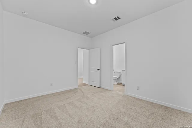 a bathroom with a granite countertop toilet a sink and a bathtub