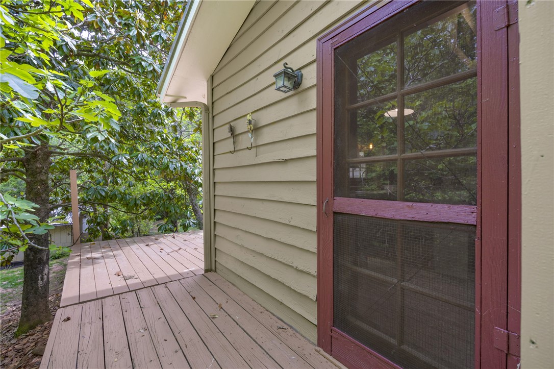 437 West Gate Road Pickens, SC 29671 - Photo 14 of 47 This charming porch and siding offer a delightful outdoor living space surrounded by nature.