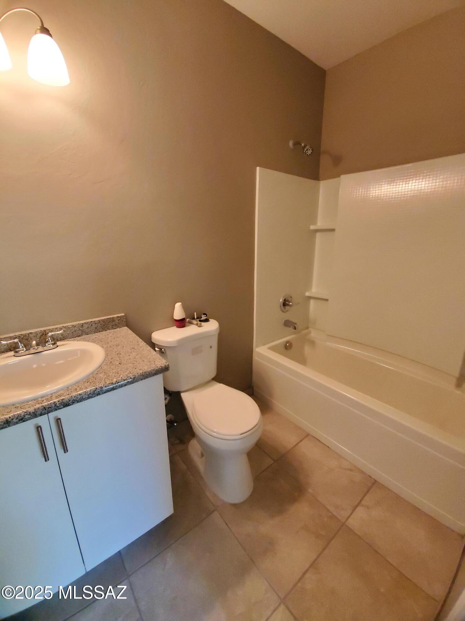 1885 Via Ochoa Rio Rico, AZ 85648 - Photo 8 of 11 a bathroom with a sink a toilet and shower
