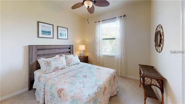 a bedroom with two beds and a baby crib